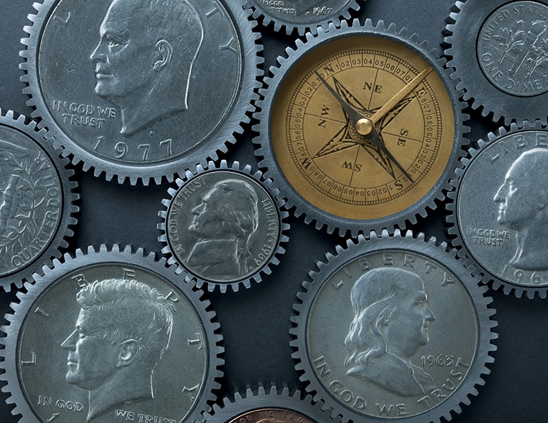 Coins and compass with gears around the outside of them